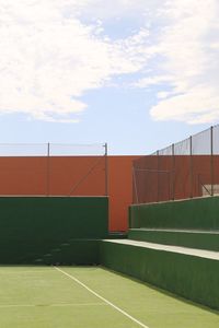 Empty playing field against sky on sunny day