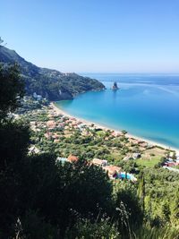 High angle view of sea against blue sky