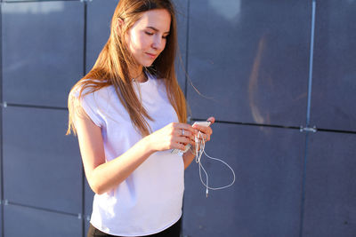 Young woman using mobile phone