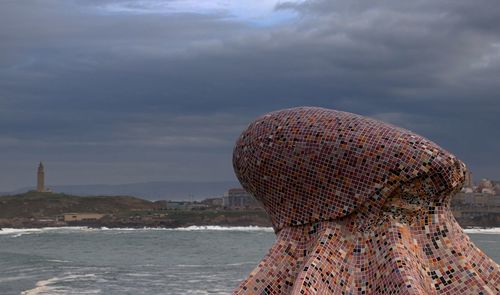 Sea shore against sky