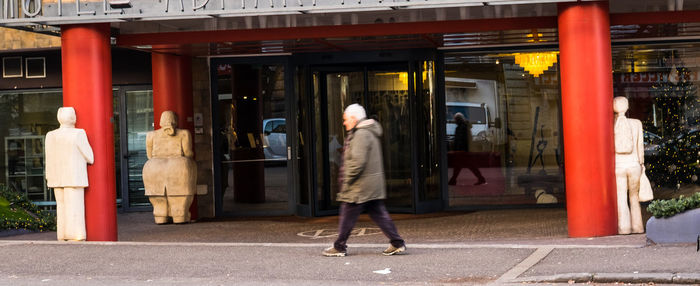 Rear view of woman walking in city