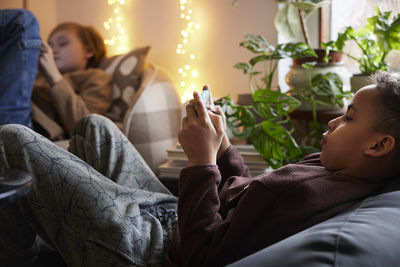 Children playing video games at home