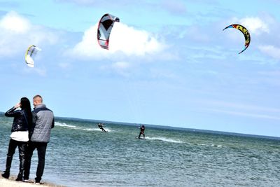 People surfing in sea