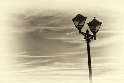 Low angle view of street light against sky