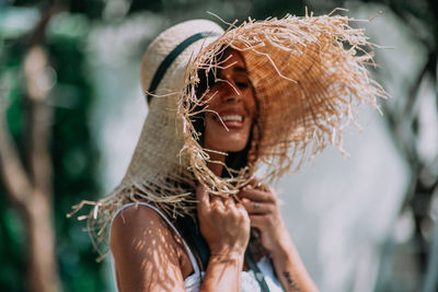 Portrait of woman wearing hat