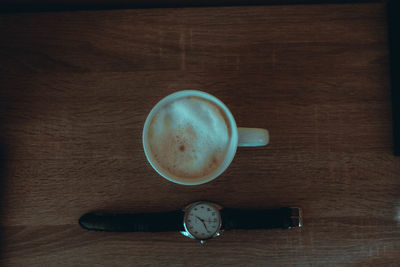 High angle view of coffee cup on table