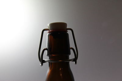 Close-up of bottle against black background