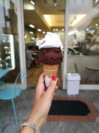 Hand holding ice cream cone