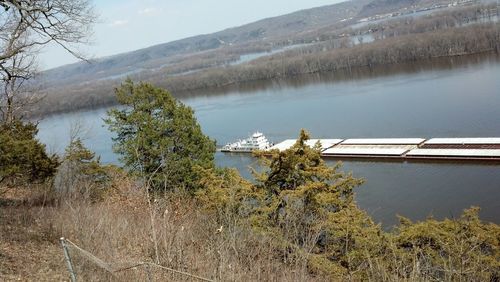 Scenic view of dam by lake against sky