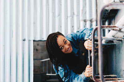 Portrait of smiling young woman standing outdoors