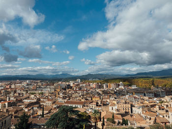 High angle shot of townscape of girona against sky