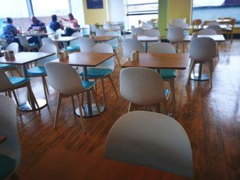 Empty chairs and table in restaurant