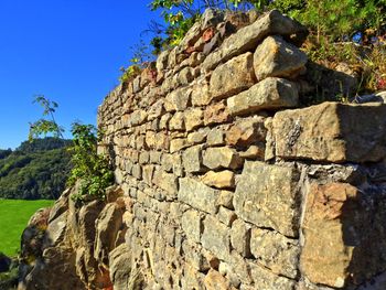 Low angle view of built structure against clear blue sky