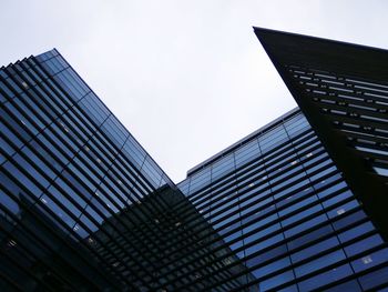 Low angle view of office building against sky