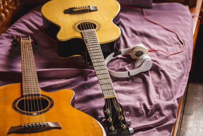 High angle view of guitar at home