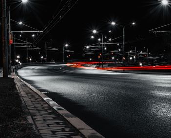 Light trails on road in city at night