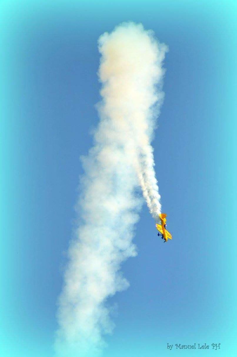 LOW ANGLE VIEW OF HELICOPTER FLYING IN SKY