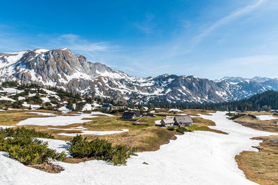 Scenic view of snowcapped mountains against sky