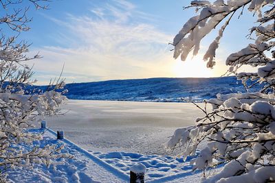 Scenic view of sea against sky during winter