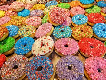 Full frame shot of multi colored donuts for sale