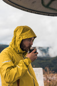 Portrait of young man standing outdoors