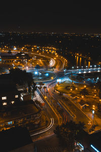 High angle view of illuminated buildings in city at night