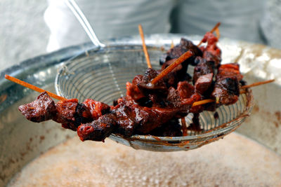 High angle view of meat on barbecue grill