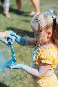 Portrait of happy litttle girl on holi color festival. cute preschooler girl on holi color festival