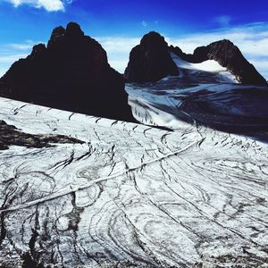 Scenic view of snow mountains against sky