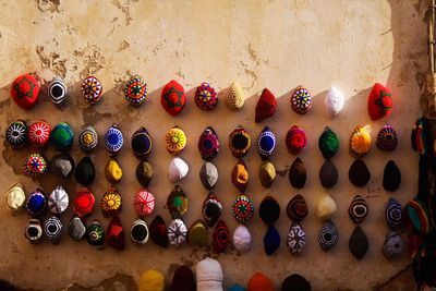 Close-up of multi colored candies on wall