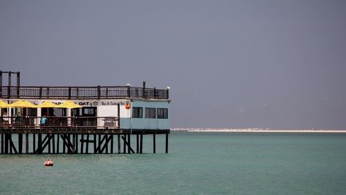 Calm sea against clear sky