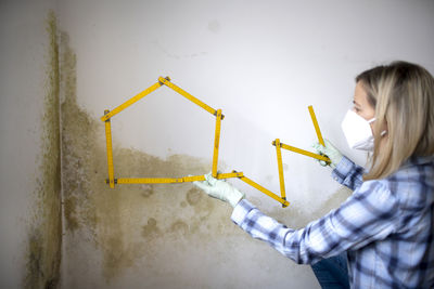 Rear view of man working at construction site