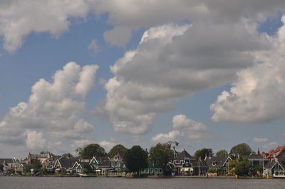 Scenic view of buildings and trees against sky