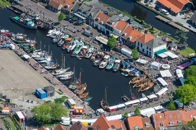 High angle view of canal amidst buildings in city