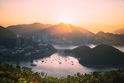 Scenic view of mountains against sunrise sky