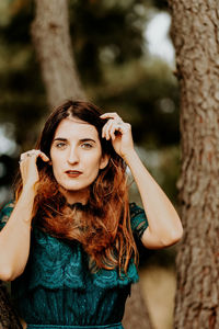 Portrait of young woman standing outdoors