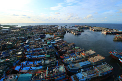 High angle view of harbor by sea against sky