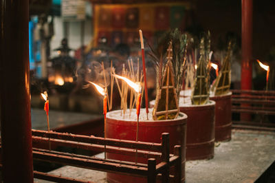 Lit candles in temple