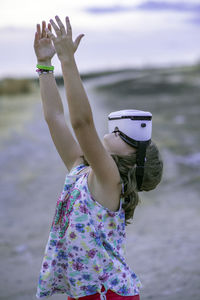 Low angle view of girl on beach