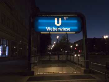 Information sign on road at night
