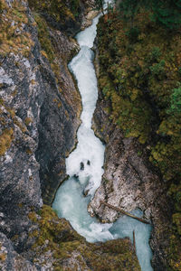 High angle view of waterfall in forest