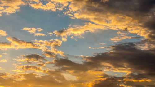 Low angle view of dramatic sky during sunset