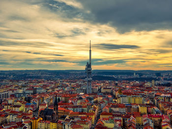 Tv tower in prague in warm summer morning with yellow sky and clouds