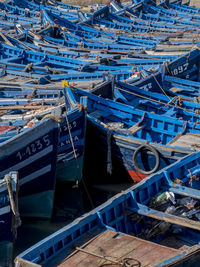 High angle view of boats moored at harbor