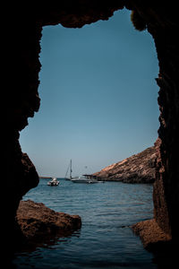 Scenic view of sea against clear blue sky