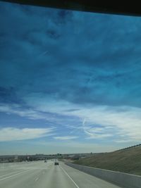 View of road against cloudy sky