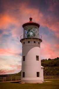 Low angle view of lighthouse against sky during sunset