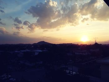 High angle view of town against sky during sunset