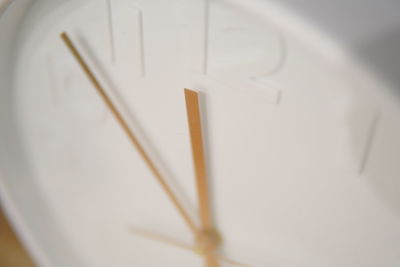 High angle view of clock on wood