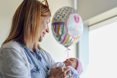 Mother with daughter at home